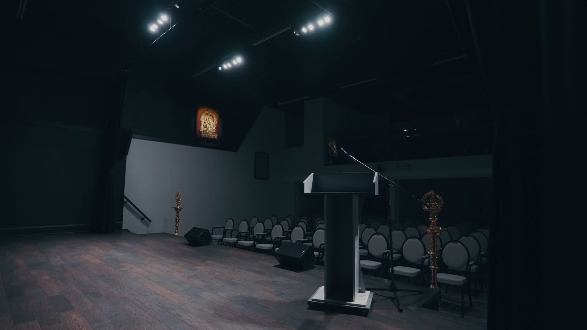 Rows of auditorium seating seen from the stage