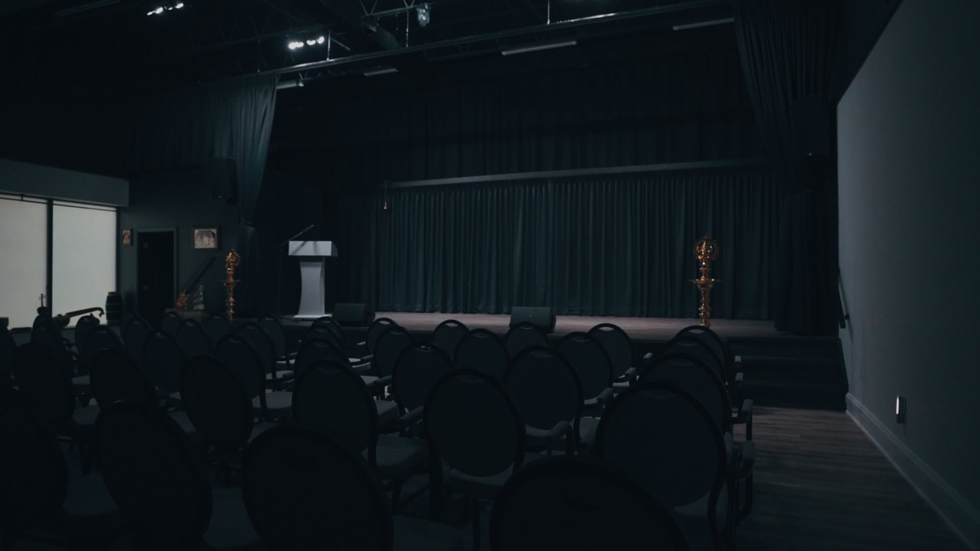 The stage at Aayakalaihal Arangam, seen from the back of the seating area